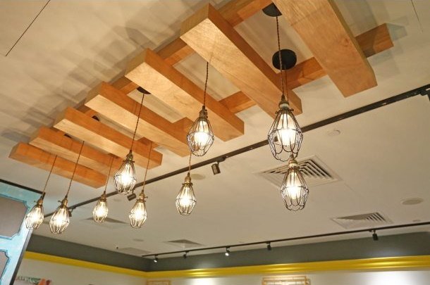 Bird Cage Hanging Light in Restaurant Setting - Comfort Furniture