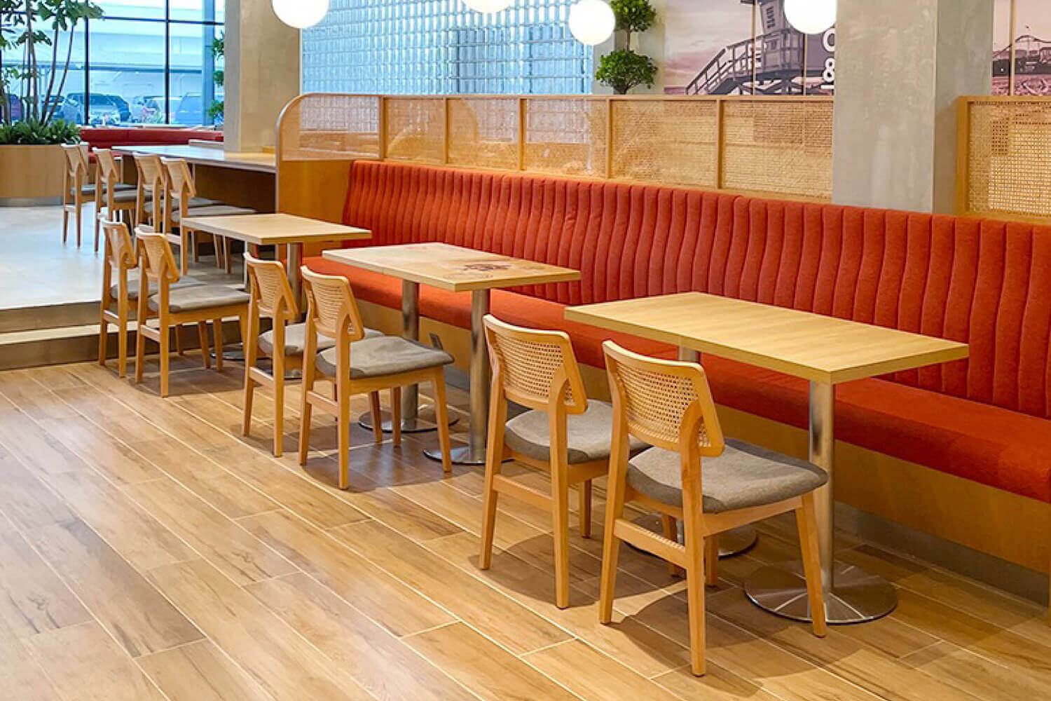Jago Rattan Chair and Orange Banquette Seats - Comfort Furniture
